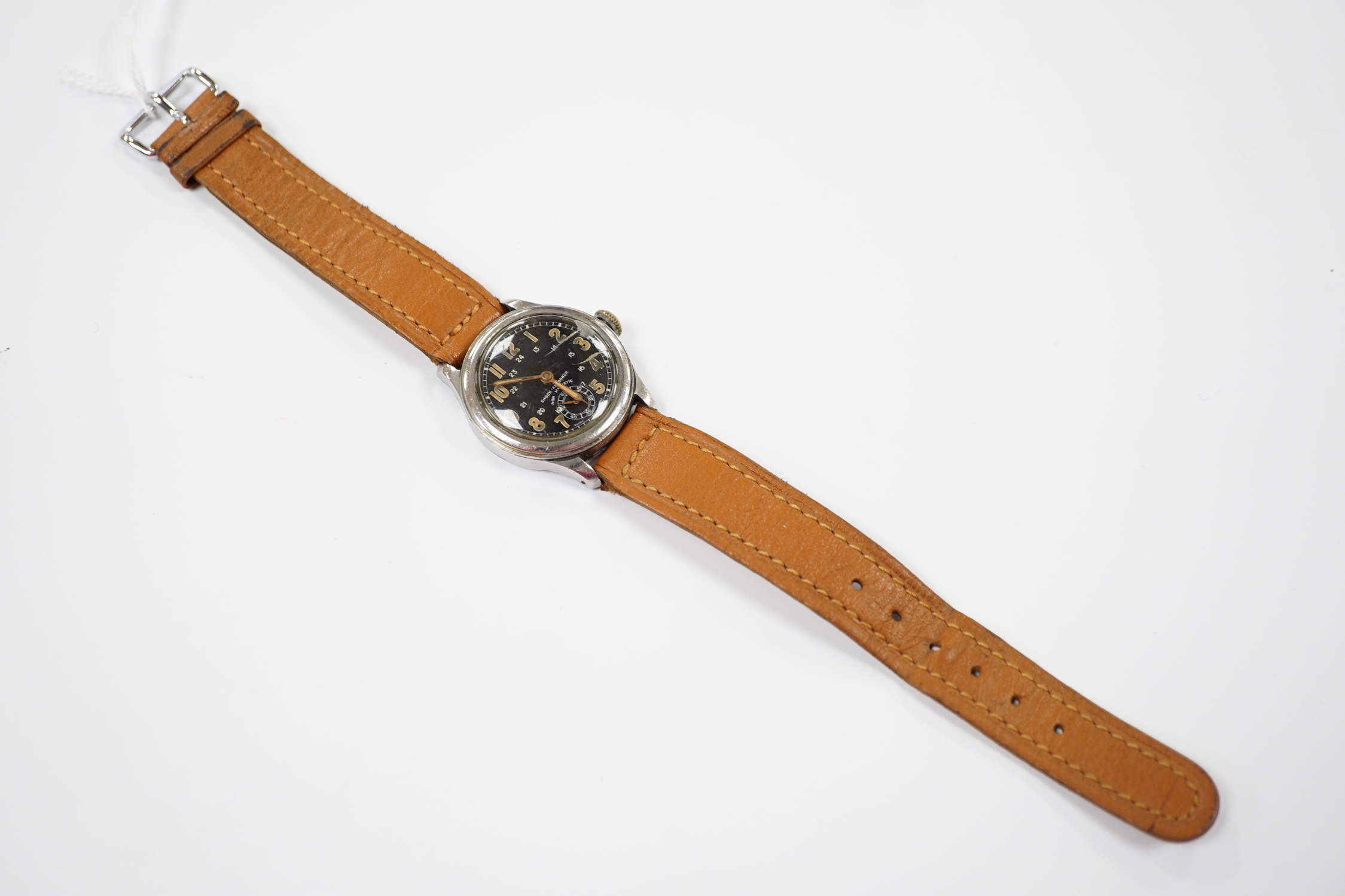 A gentleman's 1940's/1950's stainless steel manual wind wrist watch, with black Arabic dial and subsidiary seconds, on later associated leather strap.